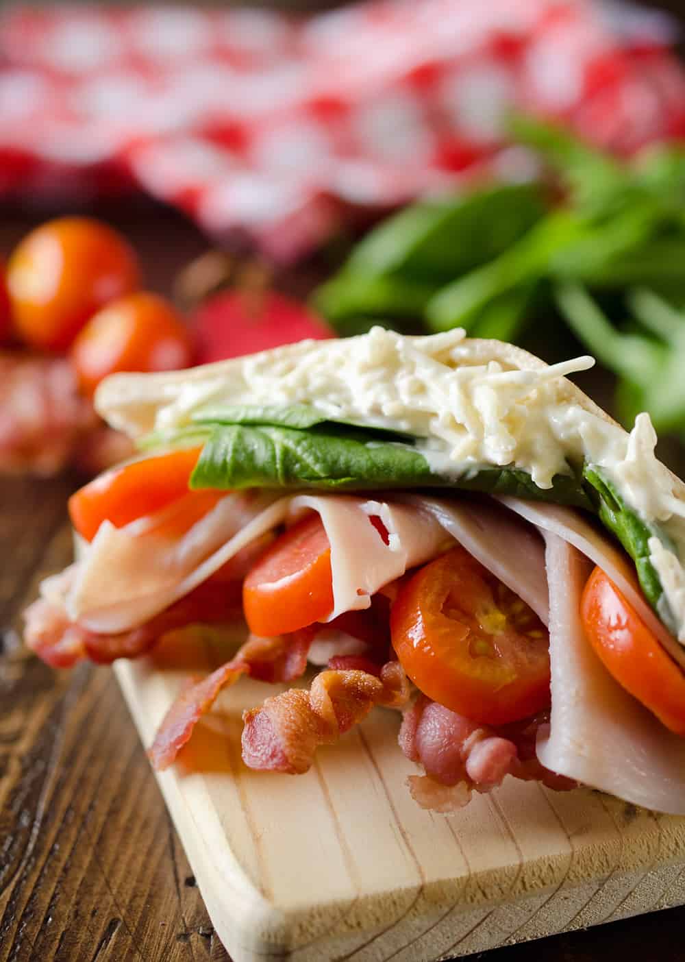 Parmesan Ranch Turkey BLT Pita is an easy and flavorful lunch loaded with bacon, lettuce, tomato, turkey and a delicious parmesan ranch. This sandwich recipe is perfect for a quick summer lunch everyone will love!