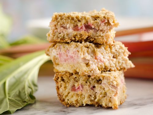 Rhubarb Custard Oatmeal Bars are a fun twist on a favorite summer treat. Fresh rhubarb and custard are layered with chewy oatmeal layers for a dessert that everyone will love!