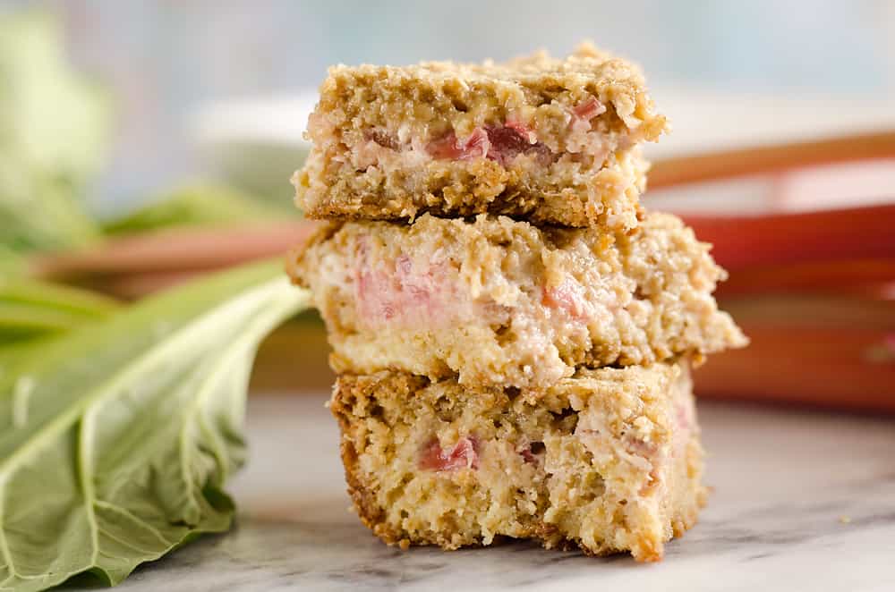 Rhubarb Custard Oatmeal Bars are a fun twist on a favorite summer treat. Fresh rhubarb and custard are layered with chewy oatmeal layers for a dessert that everyone will love!