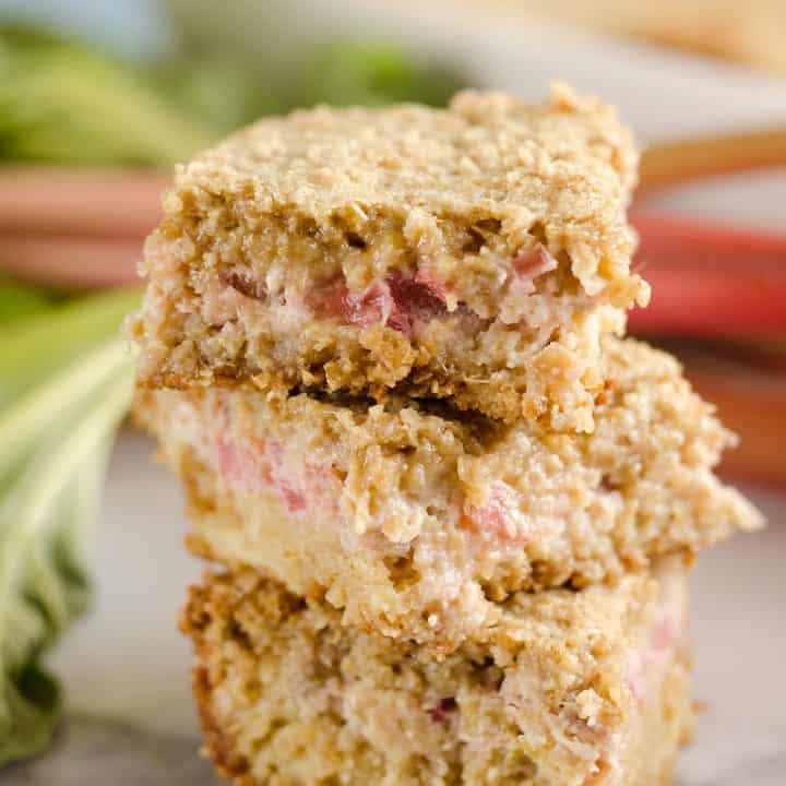Rhubarb Custard Oatmeal Bars are a fun twist on a favorite summer treat. Fresh rhubarb and custard are layered with chewy oatmeal layers for a dessert that everyone will love!
