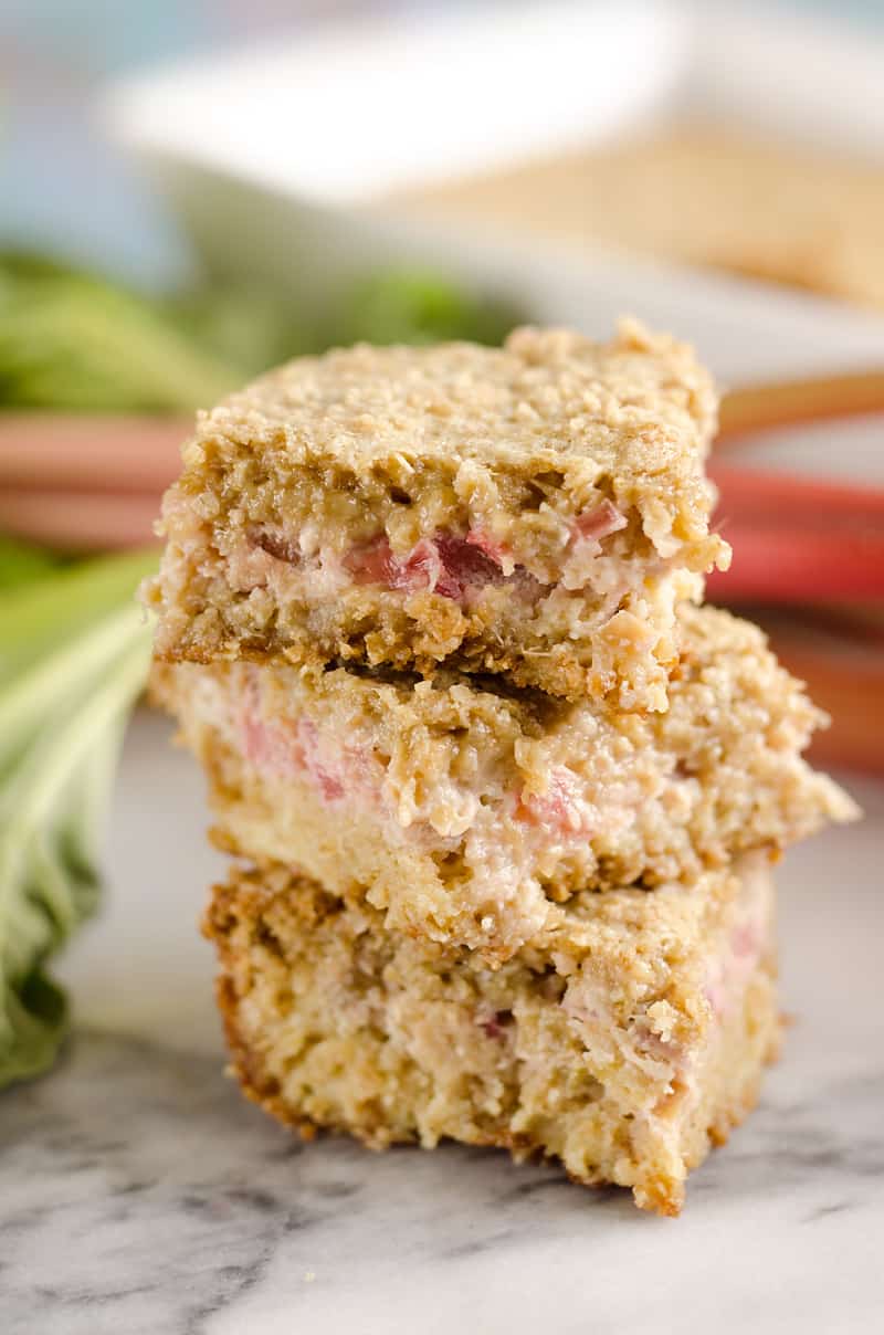 Rhubarb Custard Oatmeal Bars are a fun twist on a favorite summer treat. Fresh rhubarb and custard are layered with chewy oatmeal layers for a dessert that everyone will love!