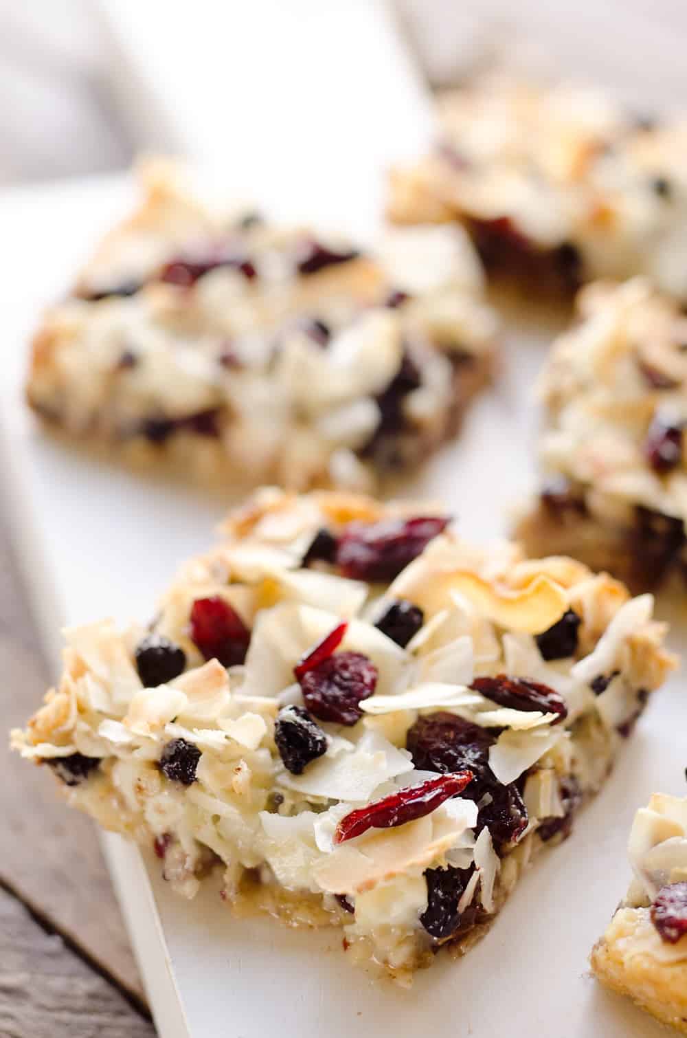 Berry Coconut Magic Bars are amazingly easy to whip together and have the great flavors of chocolate and dried berries for a fun twist on a classic dessert. 