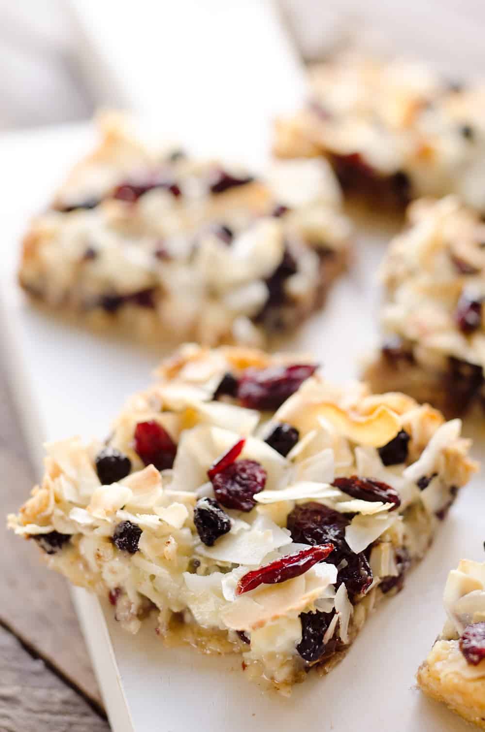 Berry Coconut Magic Bars are amazingly easy to whip together and have the great flavors of chocolate and dried berries for a fun twist on a classic dessert. 