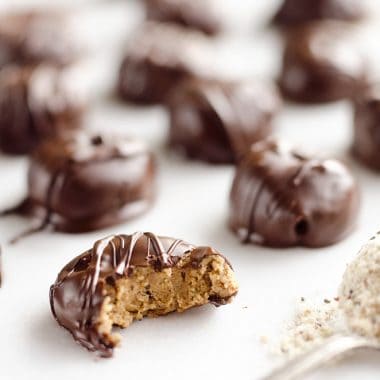 Protein Peanut Butter Truffles are an amazing 100 calorie treat packed with protein powder, chia seeds and coated in dark chocolate for healthy a dessert you can feel good about!