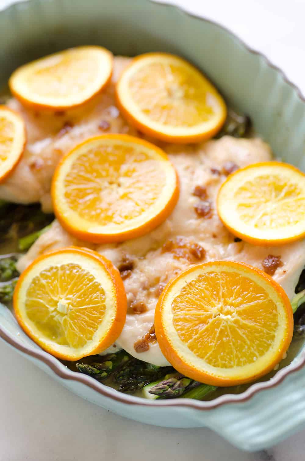 Fig & Orange Chicken Asparagus Bake is an easy and healthy one pot recipe with fresh and flavorful ingredients. Bright citrus flavor and creamy goat cheese compliment the tender chicken breasts and asparagus for a wholesome meal you will love. 