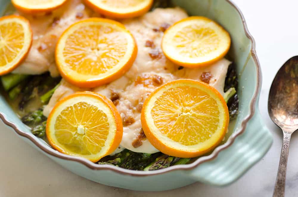Fig & Orange Chicken Asparagus Bake is an easy and healthy one pot recipe with fresh and flavorful ingredients. Bright citrus flavor and creamy goat cheese compliment the tender chicken breasts and asparagus for a wholesome meal you will love. 
