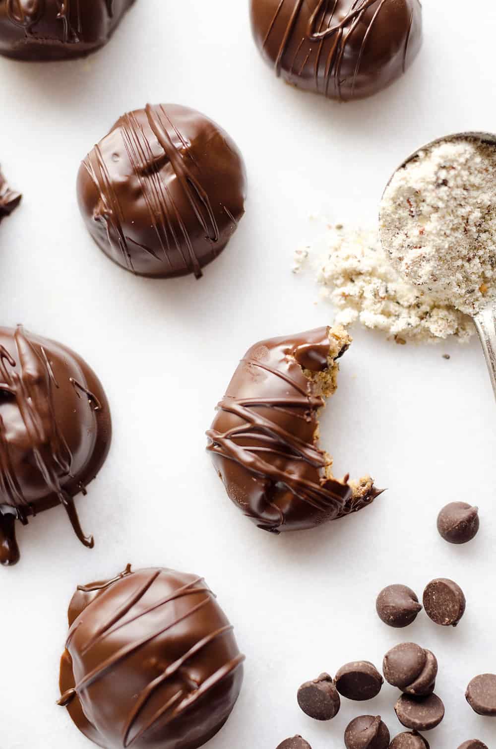 Protein Peanut Butter Truffles are an amazing 100 calorie treat packed with protein powder, chia seeds and coated in dark chocolate for healthy a dessert you can feel good about!