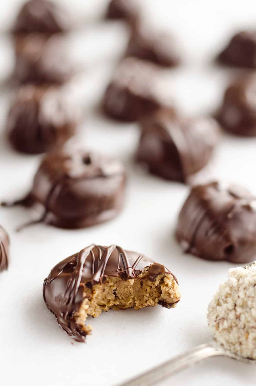 Protein Peanut Butter Truffles are an amazing 100 calorie treat packed with protein powder, chia seeds and coated in dark chocolate for healthy a dessert you can feel good about!