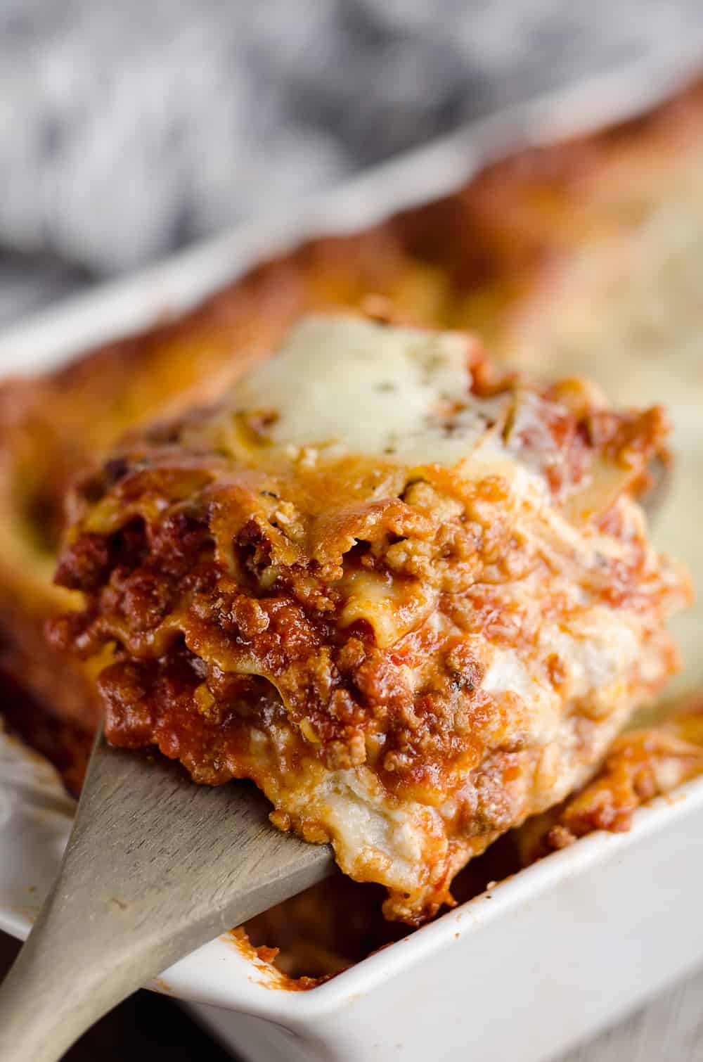 This Lasagna Recipe from my grandmother is a hearty casserole that is a classic dinner everyone will love! Ground beef and pork are layered with cheese and pasta for a comforting dinner idea perfect for a family gathering or holiday. After you have satisfied everyone's appetites with this amazing dish, clean up with all-natural Evolve dish soap for a clean and sparkling kitchen!