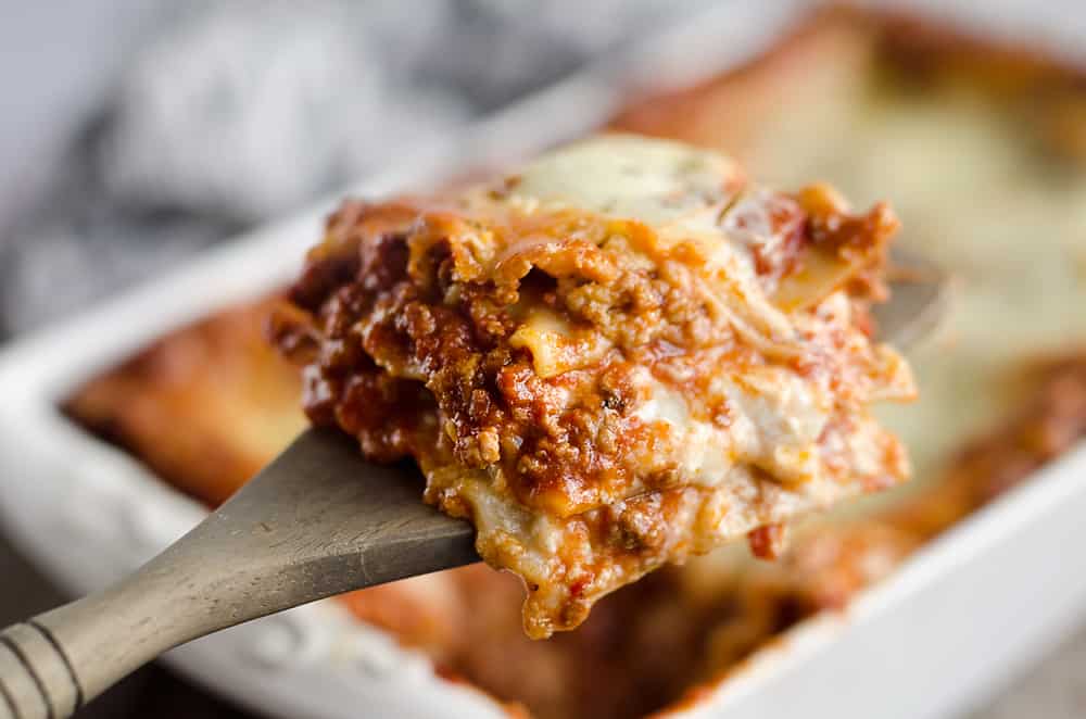 This Lasagna Recipe from my grandmother is a hearty casserole that is a classic dinner everyone will love! Ground beef and pork are layered with cheese and pasta for a comforting dinner idea perfect for a family gathering or holiday. After you have satisfied everyone's appetites with this amazing dish, clean up with all-natural Evolve dish soap for a clean and sparkling kitchen!