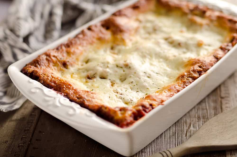 This Lasagna Recipe from my grandmother is a hearty casserole that is a classic dinner everyone will love! Ground beef and pork are layered with cheese and pasta for a comforting dinner idea perfect for a family gathering or holiday. After you have satisfied everyone's appetites with this amazing dish, clean up with all-natural Evolve dish soap for a clean and sparkling kitchen!
