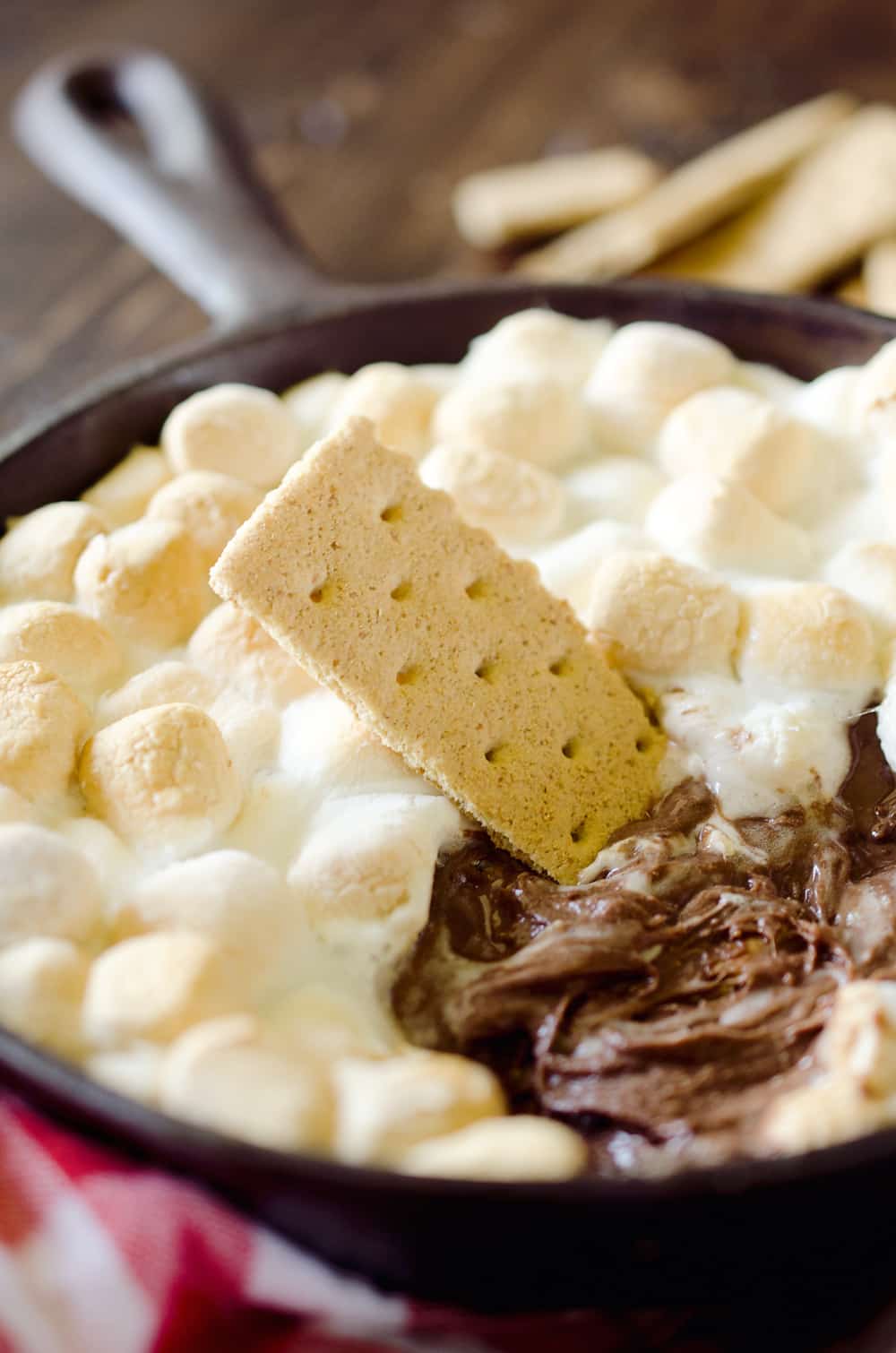 Peanut Butter S'mores Dip is the perfect sweet treat any time of year! It's made with just three ingredients and none of the smokey mess of the traditional dessert. Enjoy all the great flavors of S'mores with a peanut butter twist for a family friendly treat!