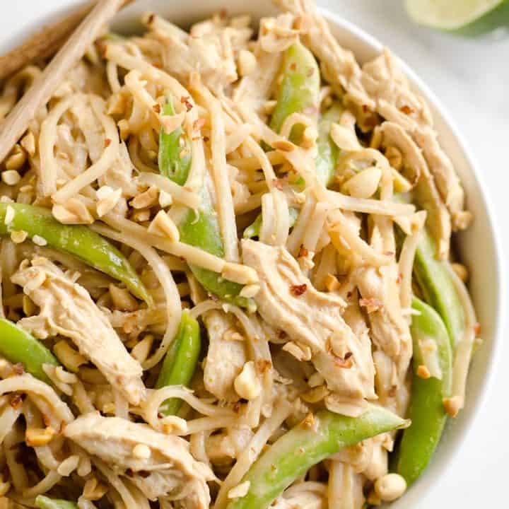 Pressure Cooker Thai Peanut Chicken & Noodles is the best 30 minute Pressure Cooker recipe you will find! Lean chicken breasts are cooked in a homemade spicy Thai peanut sauce and finished off with rice noodles and peas for an easy and healthy one-pot meal made in your Instant Pot.