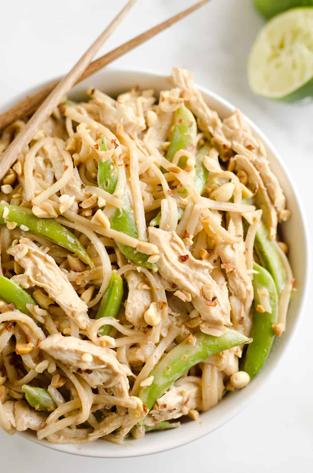 Pressure Cooker Thai Peanut Chicken & Noodles is the best 30 minute Pressure Cooker recipe you will find! Lean chicken breasts are cooked in a homemade spicy Thai peanut sauce and finished off with rice noodles and peas for an easy and healthy one-pot meal made in your Instant Pot.