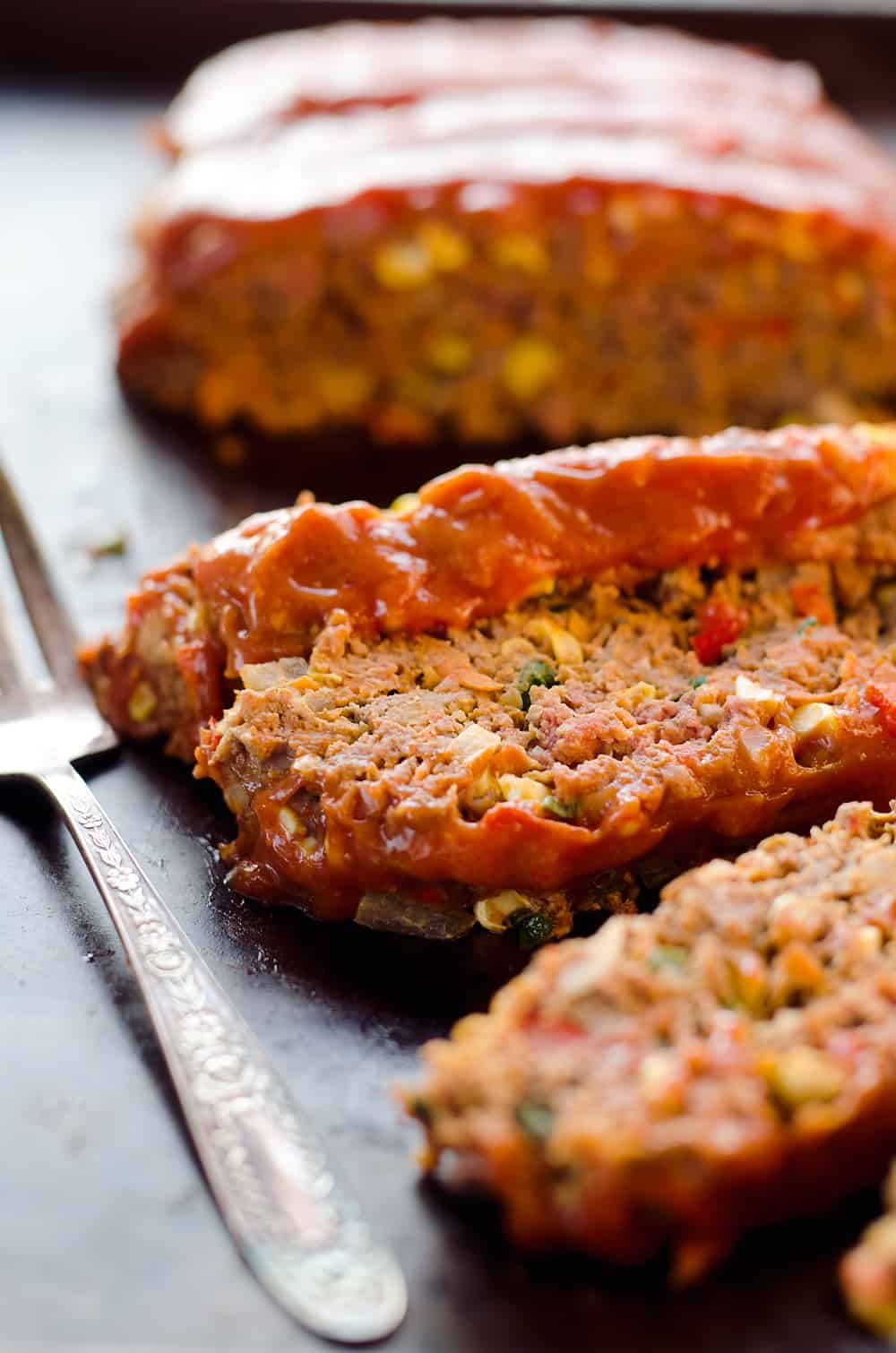 Ultimate Chorizo Meatloaf is a hearty dinner full of ground beef, chorizo, sweet corn and lots of veggies! Take your meatloaf to the next level with this spicy and flavorful recipe that is sure to be a winner. 