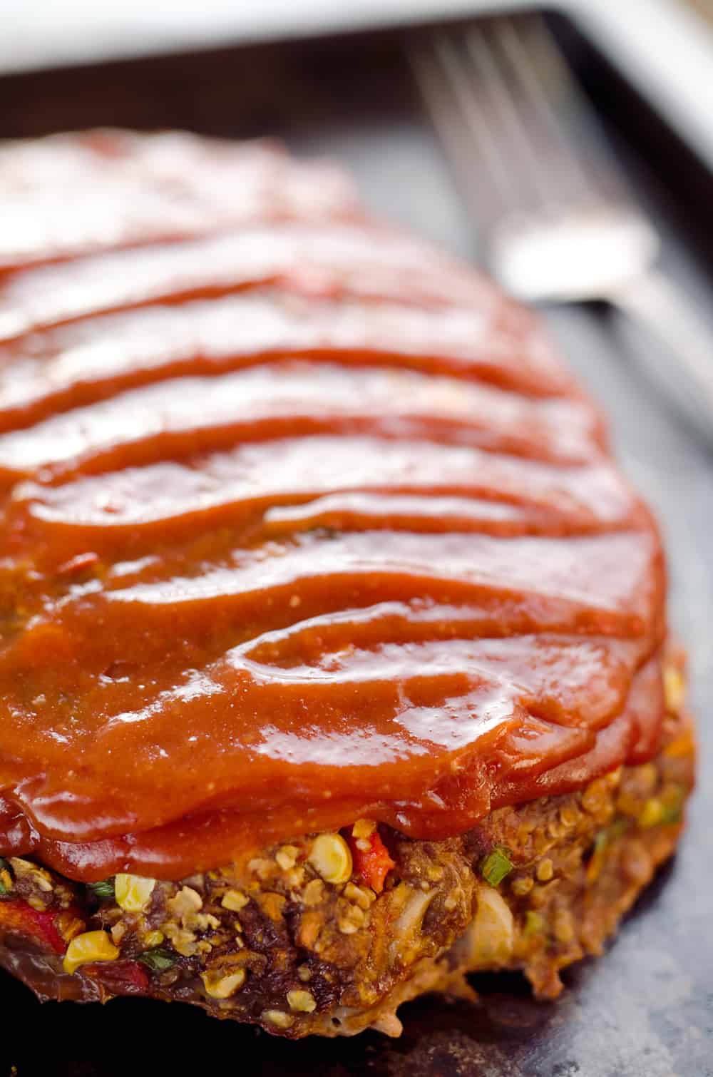 Ultimate Chorizo Meatloaf is a hearty dinner full of ground beef, chorizo, sweet corn and lots of veggies! Take your meatloaf to the next level with this spicy and flavorful recipe that is sure to be a winner. 