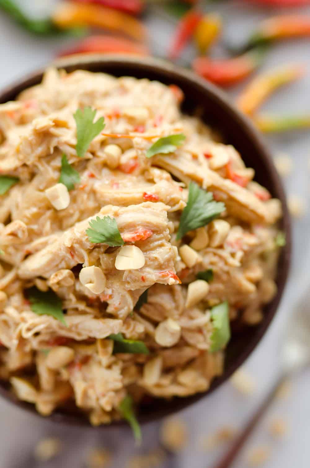 Crock Pot Thai Peanut Chicken is an easy weeknight dinner idea you can make with everything from rice and veggies to lettuce cups for a healthy and delicious meal!