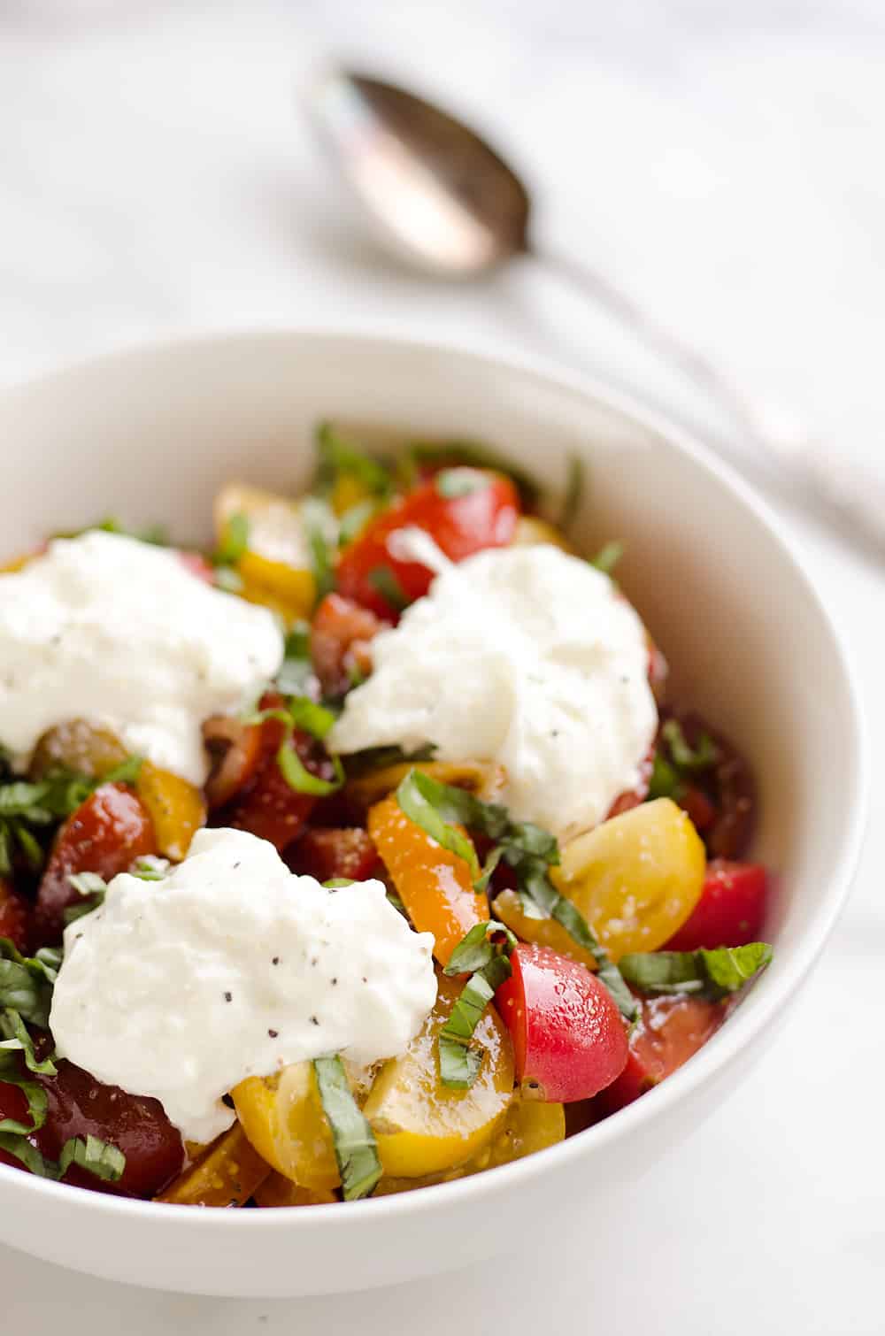 Fresh Tomato Basil & Burrata Salad is a healthy and delicious salad made with simple ingredients for a side dish that pairs well with just about everything!