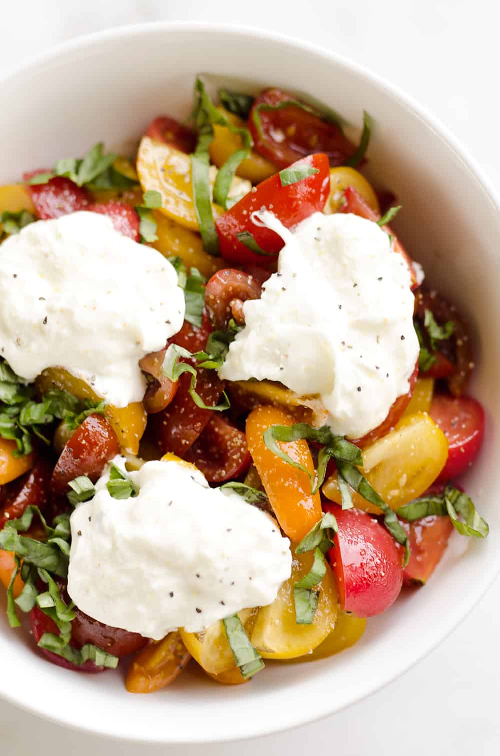 Fresh Tomato Basil & Burrata Salad is a healthy and delicious salad made with simple ingredients for a side dish that pairs well with just about everything!