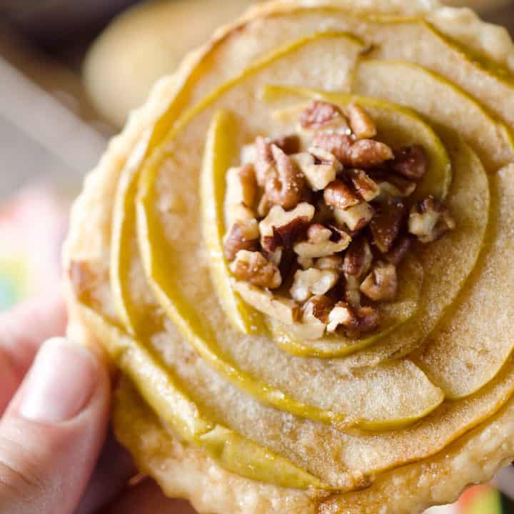 Mini Apple & Browned Butter Tarts are a perfectly light treat with great fall flavors! This dessert includes a flaky pie crust topped with apples and pecans and finished off with decadent browned butter for a bite-sized sweet perfect for holiday parties.