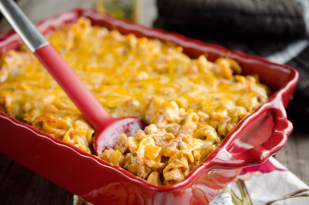 Sour Cream Cheesy Hamburger Hotdish is an easy and comforting dinner idea full of hearty hamburger, vegetables and pasta. This family friendly recipe is sure to be a staple in your meal plans!