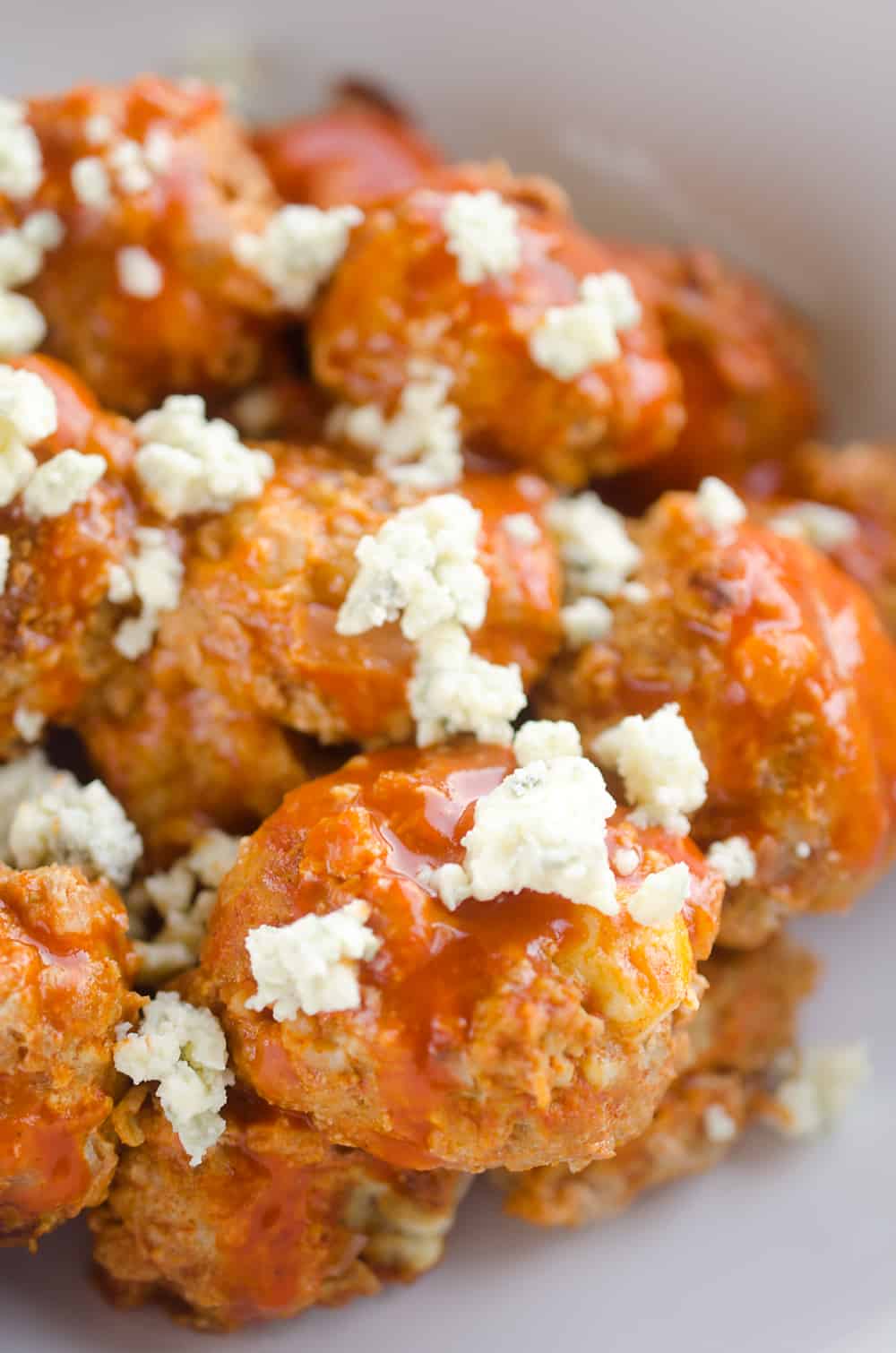 Light Crock Pot Buffalo Turkey Meatballs are an easy recipe made in your slow cooker bursting with bold flavor from spicy buffalo sauce and bleu cheese crumbles! Serve them as an appetizer on game day or pair them with a side of rice and veggies for a flavorful dinner.