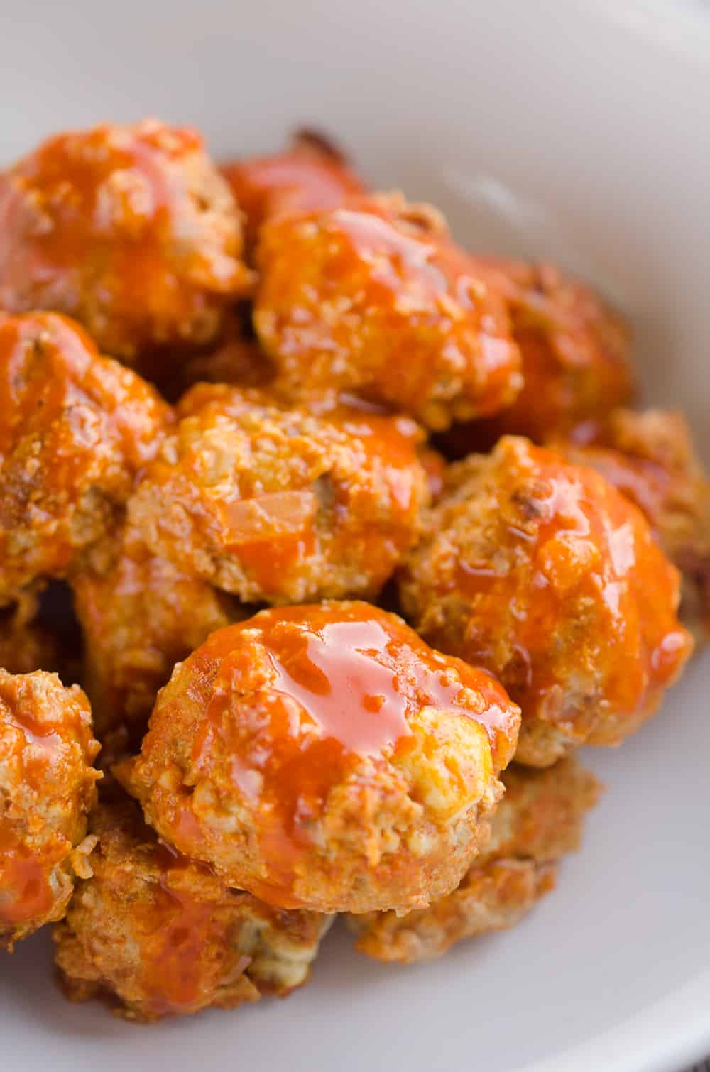 Light Crock Pot Buffalo Turkey Meatballs are an easy recipe made in your slow cooker bursting with bold flavor from spicy buffalo sauce and bleu cheese crumbles! Serve them as an appetizer on game day or pair them with a side of rice and veggies for a flavorful dinner.