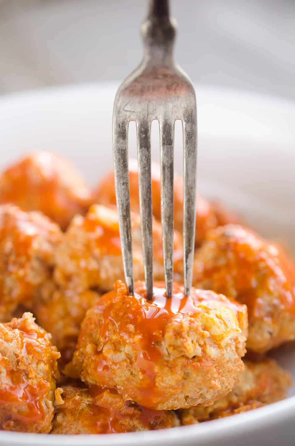 Light Crock Pot Buffalo Turkey Meatballs are an easy recipe made in your slow cooker bursting with bold flavor from spicy buffalo sauce and bleu cheese crumbles! Serve them as an appetizer on game day or pair them with a side of rice and veggies for a flavorful dinner.