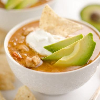 Pressure Cooker Chicken Tortilla Soup is a quick and easy soup recipe made in your Instant Pot that is bursting with bold and spicy flavors!