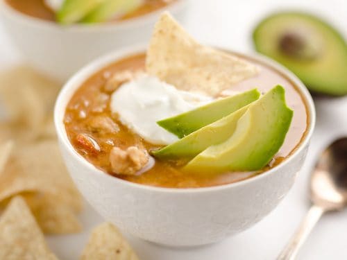 Pressure Cooker Chicken Tortilla Soup is a quick and easy soup recipe made in your Instant Pot that is bursting with bold and spicy flavors!