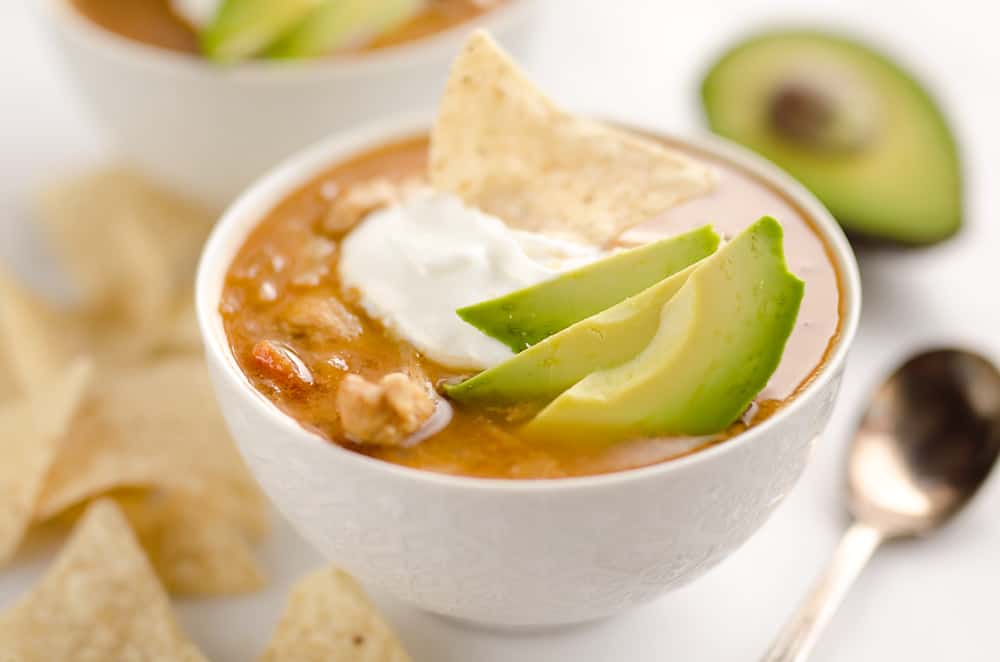 Pressure Cooker Chicken Tortilla Soup is a quick and easy soup recipe made in your Instant Pot that is bursting with bold and spicy flavors! 