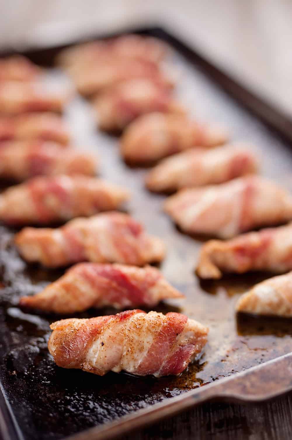 Sweet & Spicy Bacon Wrapped Turkey Tenders are a delicious appetizer paired with a homemade honey mustard for the ultimate game day finger food! They also make a great dinner idea with a side of rice and veggies. 