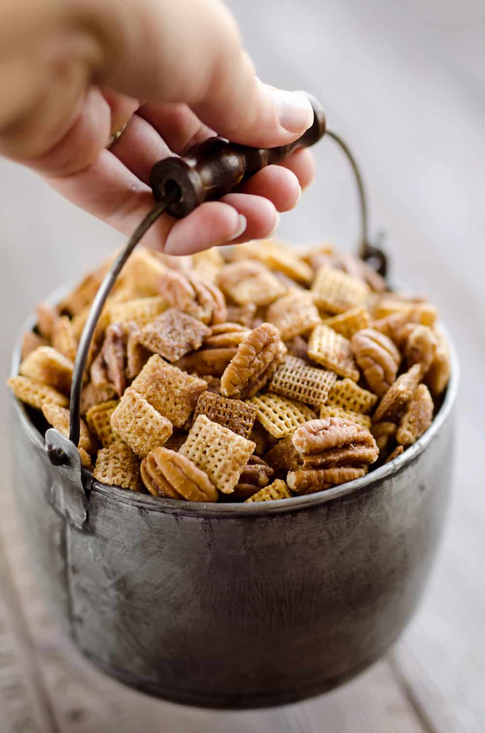 Sweet & Spicy Pecan Snack Mix is a delicious treat with Chex coated in a spicy cinnamon brown sugar mixture and tossed with pecans. This delicious Chex Mix will disappear quickly at your next holiday gathering! 