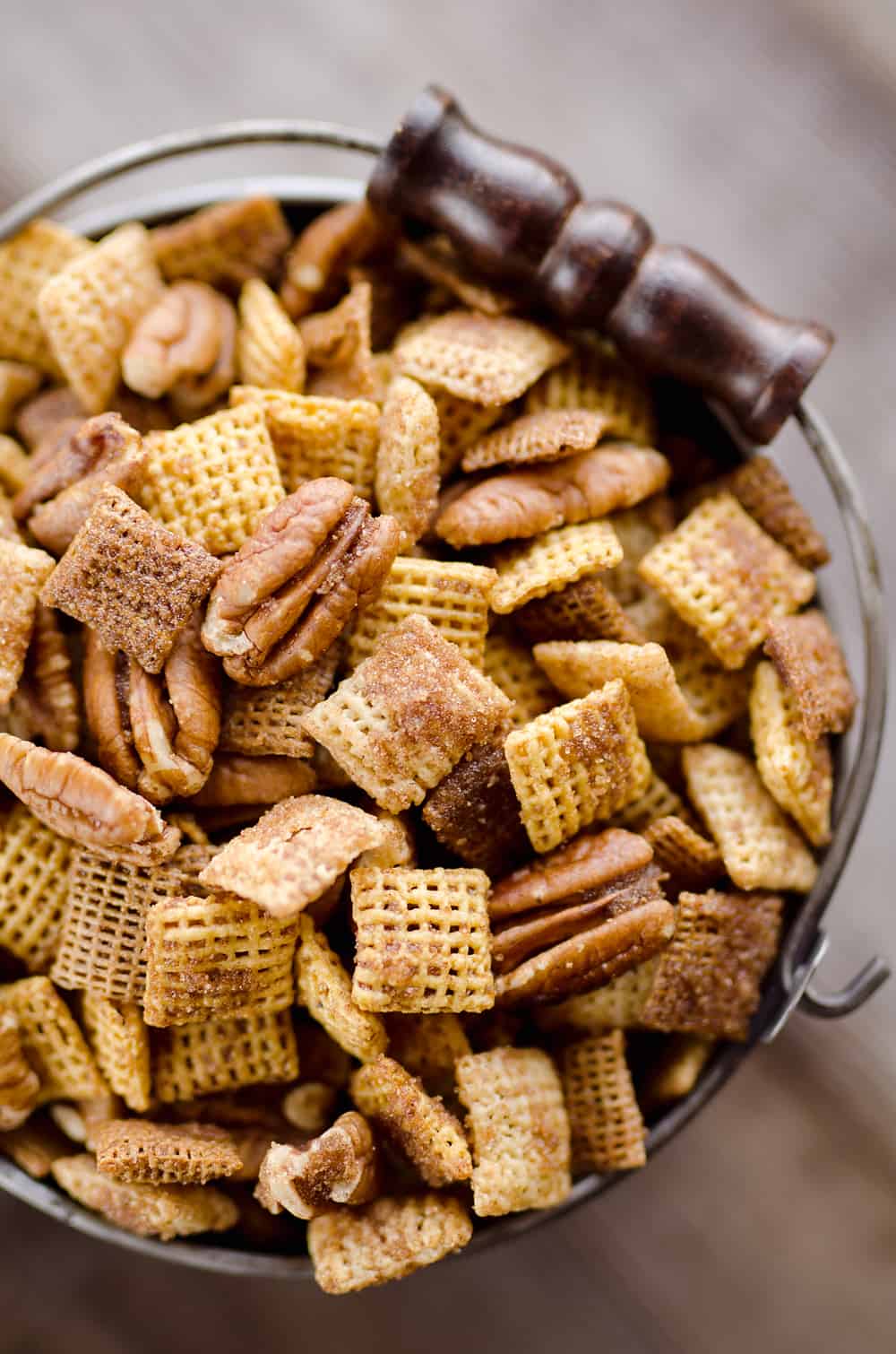 Sweet & Spicy Pecan Snack Mix is a delicious treat with Chex coated in a spicy cinnamon brown sugar mixture and tossed with pecans. This delicious Chex Mix will disappear quickly at your next holiday gathering!