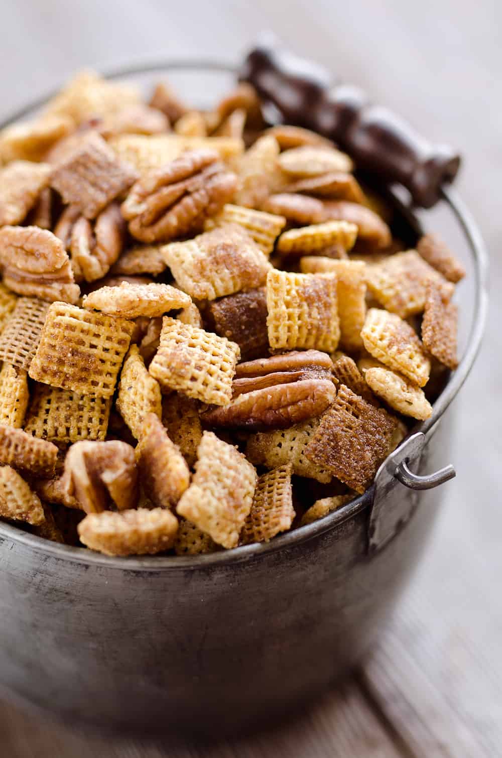 Sweet & Spicy Pecan Snack Mix is a delicious treat with Chex coated in a spicy cinnamon brown sugar mixture and tossed with pecans. This delicious Chex Mix will disappear quickly at your next holiday gathering! 