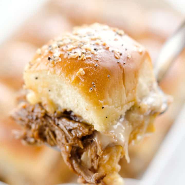 Cheesy BBQ Pork Baked Sliders are and easy family friendly meal you will want to make again and again! Pressure Cooker BBQ Pulled Pork and creamy Havarti cheese is layered on Hawaiian buns and topped with a savory butter sauce for a dinner that is absolutely drool worthy.