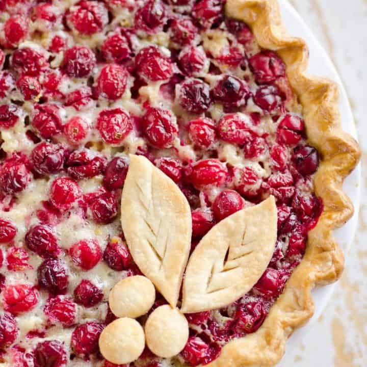 Cranberry Custard Pie topped with decorative pie crust cutouts