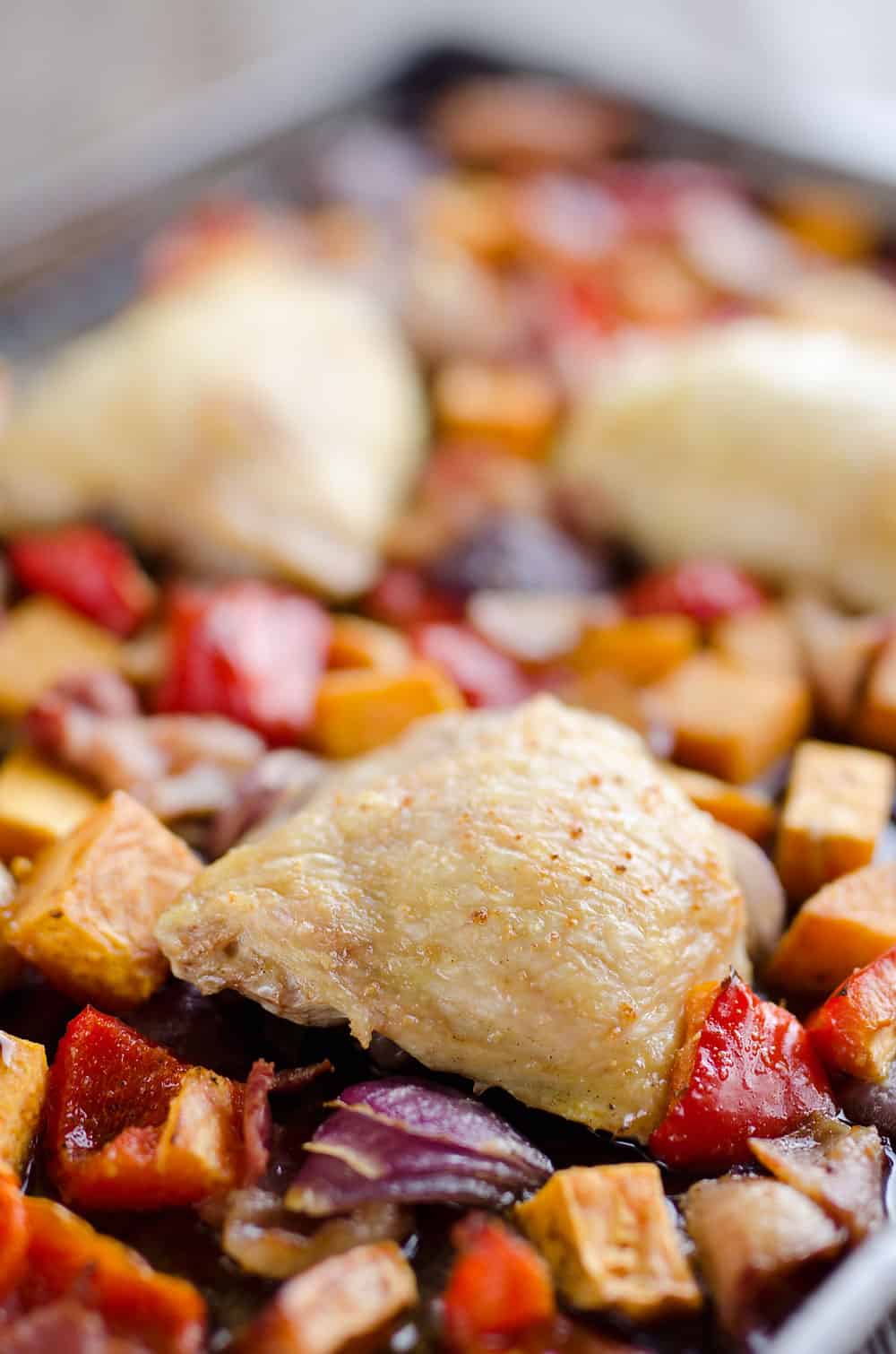 Harvest Chicken Sheet Pan Dinner is an easy and healthy dinner with chicken thighs and roasted vegetables that will come together in no time!
