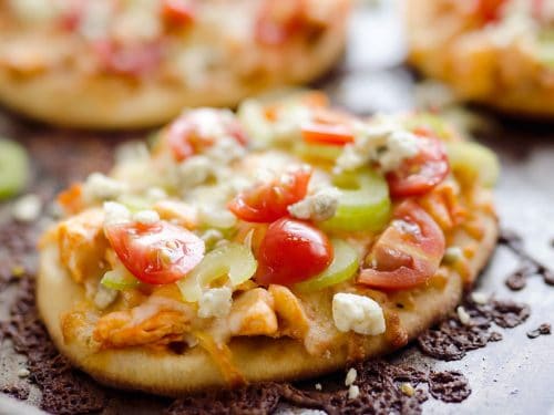 Mini Buffalo Turkey Pizzas are an easy and flavorful way to use up leftover turkey for a quick and delicious dinner idea or crowd pleasing finger food for game day!