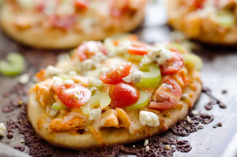 Mini Buffalo Turkey Pizzas are an easy and flavorful way to use up leftover turkey for a quick and delicious dinner idea or crowd pleasing finger food for game day!