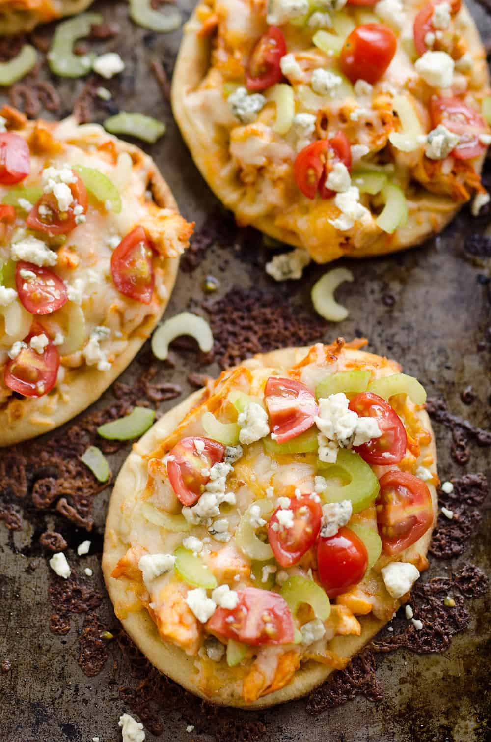 Mini Buffalo Turkey Pizzas are an easy and flavorful way to use up leftover turkey for a quick and delicious dinner idea or crowd pleasing finger food for game day!
