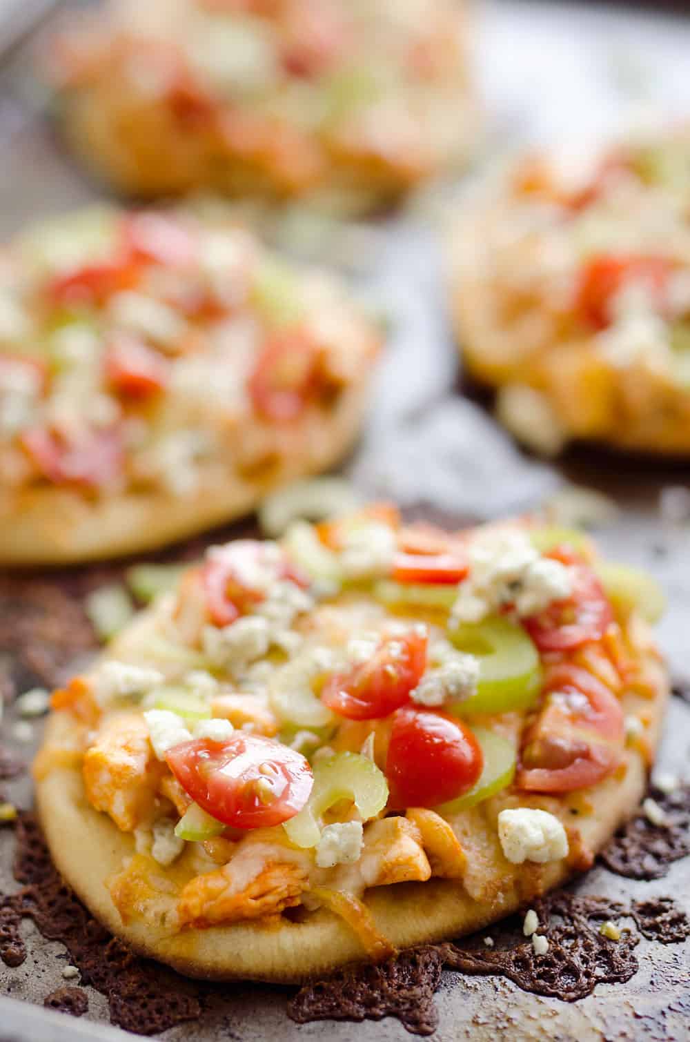 Mini Buffalo Turkey Pizzas are an easy and flavorful way to use up leftover turkey for a quick and delicious dinner idea or crowd pleasing finger food for game day!