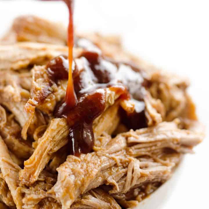 Pressure Cooker BBQ Pulled Pork is an easy three ingredient recipe that makes for tender and delicious pork that is perfect for sandwiches or wonderful paired with rice and vegetables for a healthy dinner idea.