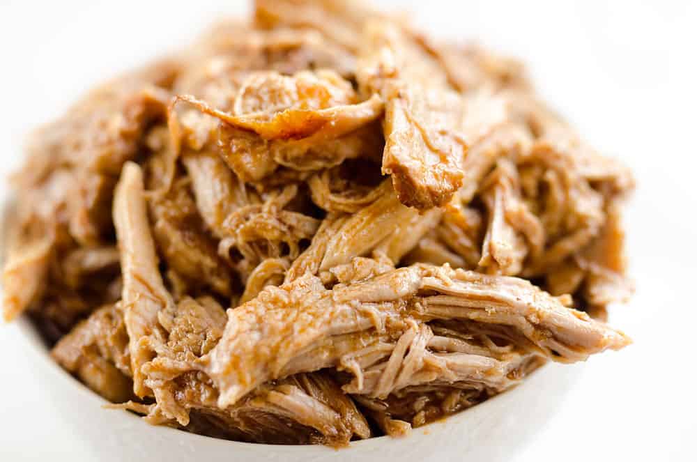Pressure Cooker BBQ Pulled Pork is an easy three ingredient recipe that makes for tender and delicious pork that is perfect for sandwiches or wonderful paired with rice and vegetables for a healthy dinner idea. 