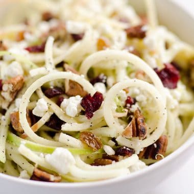 Spiralized Apple Cranberry Salad in white bowl