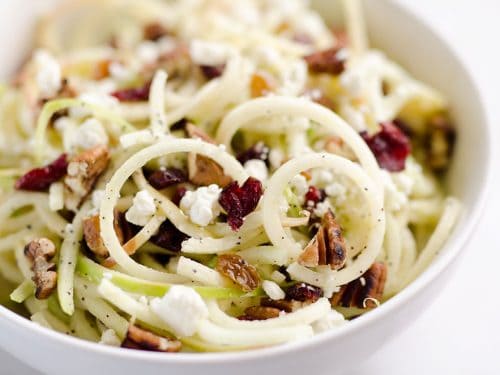 Spiralized Apple Cranberry Salad in white bowl