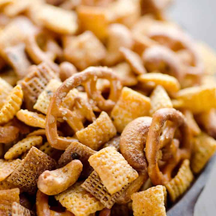 Buffalo Ranch Snack Mix is an easy treat perfect for the big game or holidays. Chex Mix is combined with pretzels and cashews and tossed in a spicy buffalo ranch sauce for a twist on your traditional snack mix.