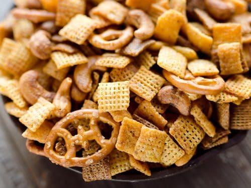 Buffalo Ranch Snack Mix is an easy treat perfect for the big game or holidays. Chex Mix is combined with pretzels and cashews and tossed in a spicy buffalo ranch sauce for a twist on your traditional snack mix.