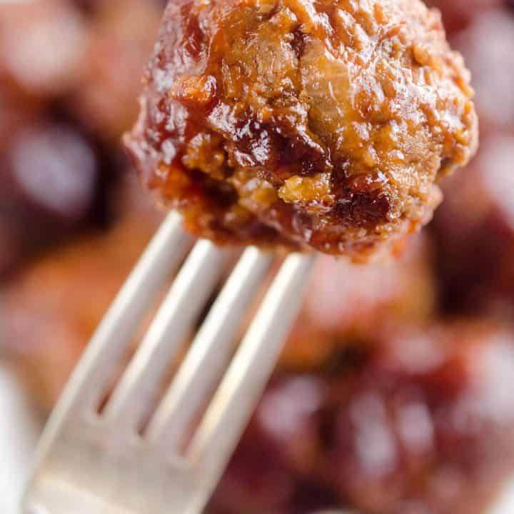 Crock Pot Cheddar BBQ Meatballs make for a flavor packed dinner paired with potatoes or a fantastic appetizer for the big game or holiday bash! Tender beef meatballs loaded with onion and cheese are simmered in your favorite BBQ sauce for a wonderful recipe made in your slow cooker.