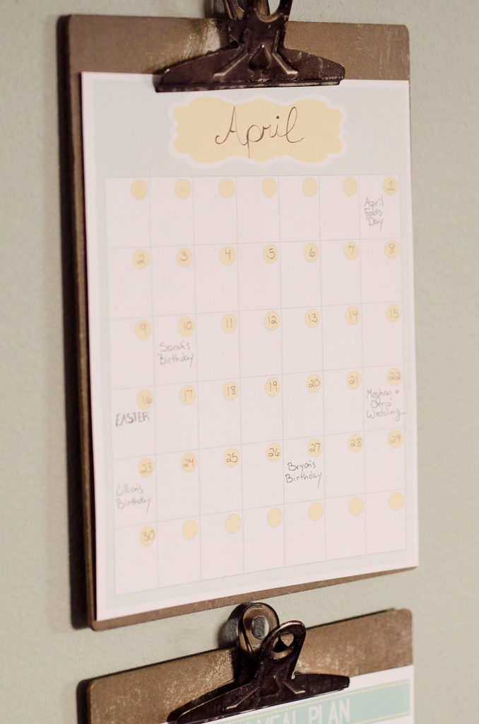 Free Printable Meal Planner calendar hanging on clip board